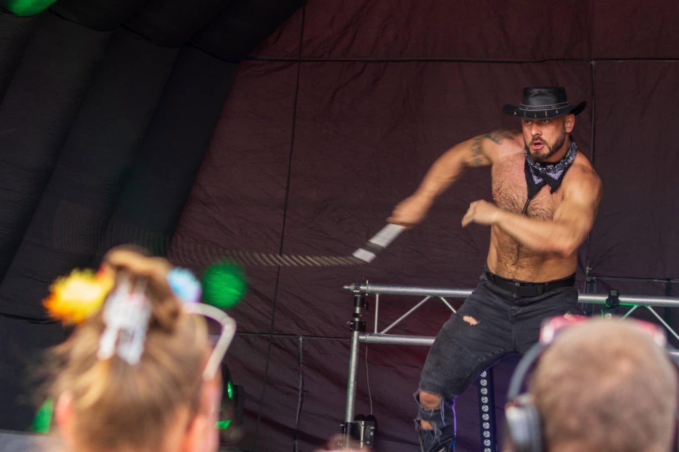 Marshall Arkley - 2024 Performer in a hat dancing energetically on stage, engaging with the audience.